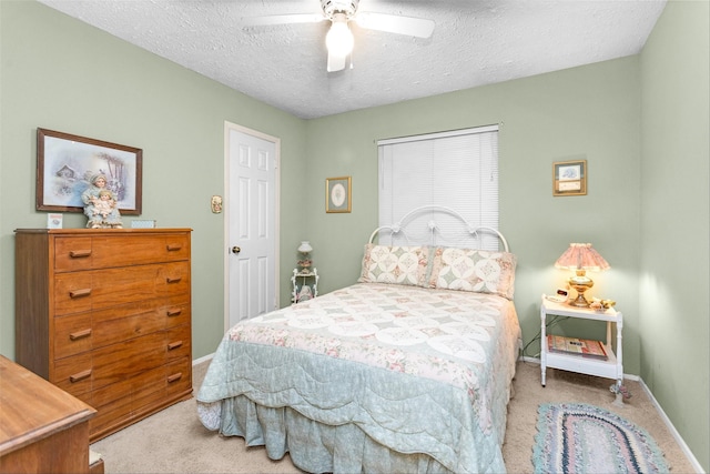 4818 Lost Lake Ln, Spring, TX 77388 - bedroom with carpet flooring, a textured ceiling, and a ceiling fan