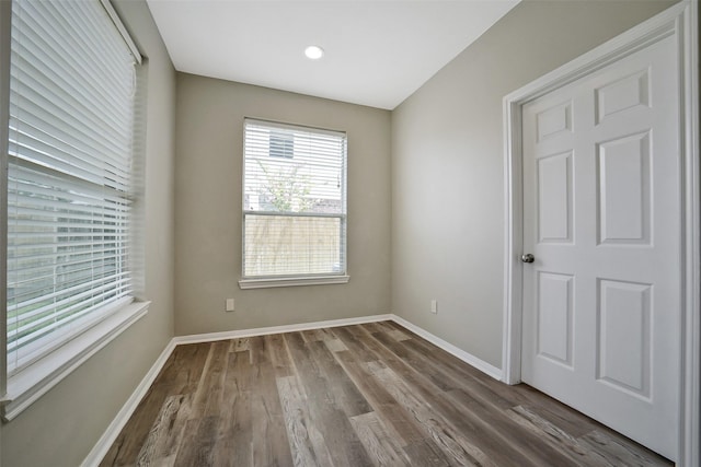 21326 Pebble Pine Trl, Cypress, TX 77433 - empty room with dark wood-style flooring and recessed lighting