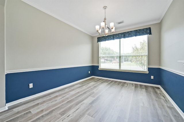 21326 Pebble Pine Trl, Cypress, TX 77433 - empty room featuring a chandelier, wood finished floors, crown molding, and vaulted ceiling