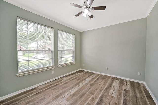 21326 Pebble Pine Trl, Cypress, TX 77433 - empty room with ornamental molding, healthy amount of natural light, wood finished floors, and a ceiling fan