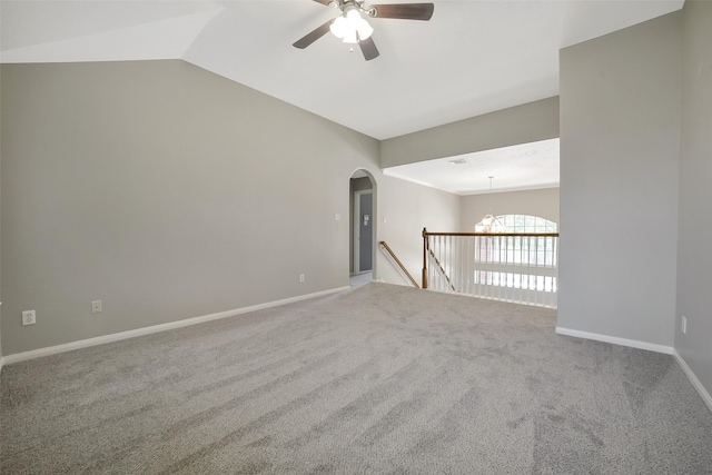 21326 Pebble Pine Trl, Cypress, TX 77433 - carpeted spare room featuring a ceiling fan, vaulted ceiling, and arched walkways