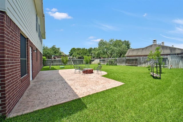 21326 Pebble Pine Trl, Cypress, TX 77433 - fenced backyard featuring a patio and an outdoor fire pit