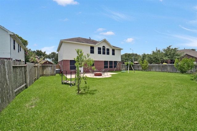 21326 Pebble Pine Trl, Cypress, TX 77433 - back of house with brick siding, a patio, a fire pit, and a fenced backyard