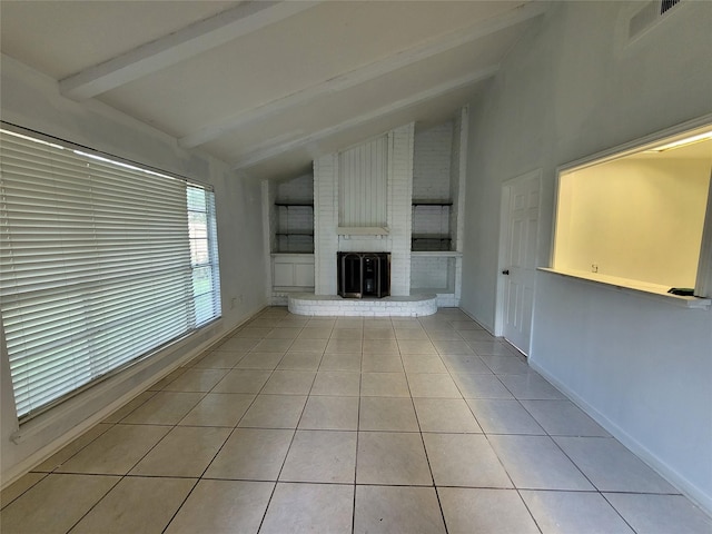 13930 New Village Ln, Sugar Land, TX 77498 - unfurnished living room featuring light tile patterned floors, a brick fireplace, beamed ceiling, and high vaulted ceiling