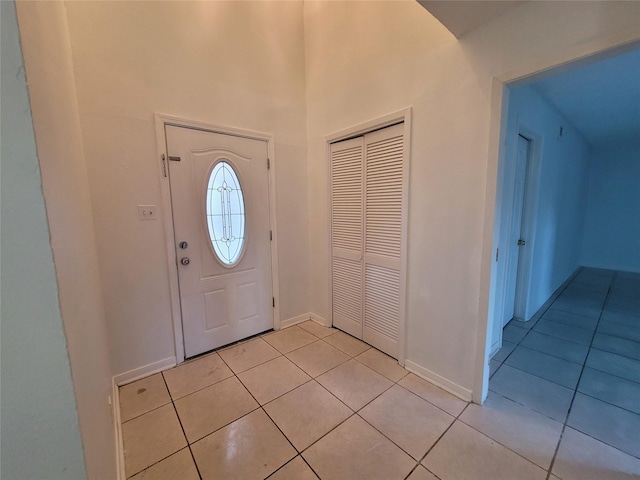 13930 New Village Ln, Sugar Land, TX 77498 - entryway featuring light tile patterned floors and baseboards