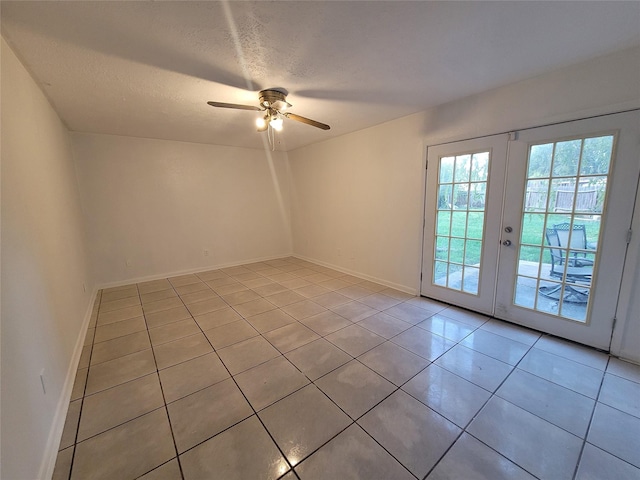 13930 New Village Ln, Sugar Land, TX 77498 - unfurnished room with light tile patterned floors, french doors, a ceiling fan, and a textured ceiling