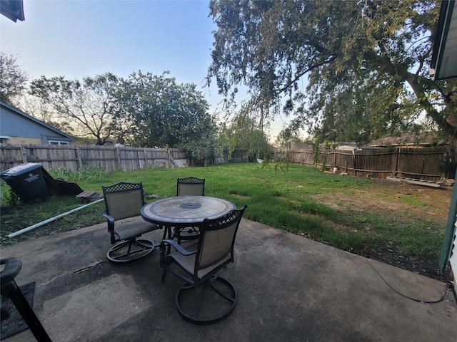 13930 New Village Ln, Sugar Land, TX 77498 - fenced backyard with a patio and outdoor dining space