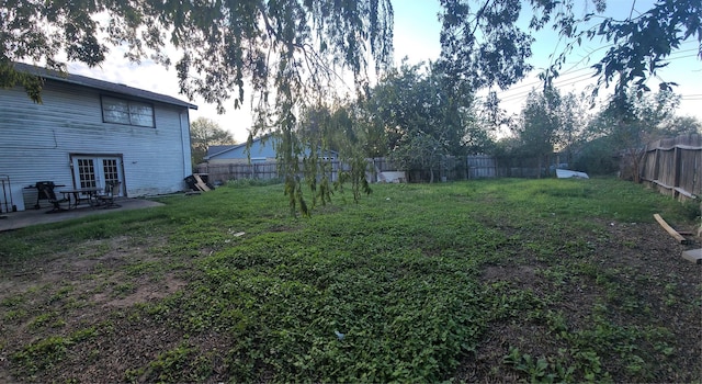 13930 New Village Ln, Sugar Land, TX 77498 - fenced backyard featuring french doors and a patio
