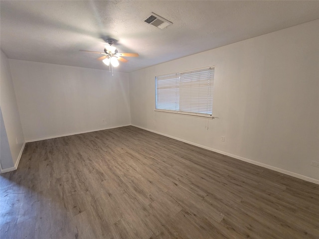 13930 New Village Ln, Sugar Land, TX 77498 - spare room featuring ceiling fan and dark wood-style floors