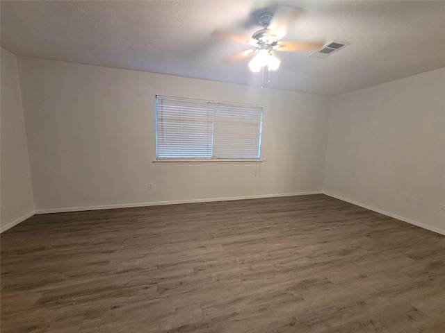 13930 New Village Ln, Sugar Land, TX 77498 - spare room with ceiling fan and dark wood-style floors