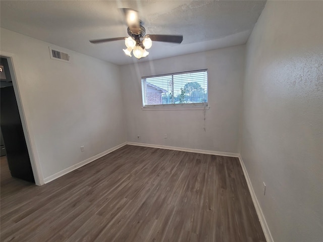 13930 New Village Ln, Sugar Land, TX 77498 - unfurnished room with dark wood finished floors and a ceiling fan