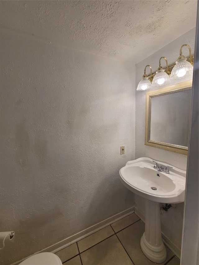 13930 New Village Ln, Sugar Land, TX 77498 - bathroom with tile patterned floors and a textured ceiling