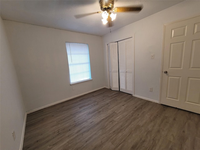 13930 New Village Ln, Sugar Land, TX 77498 - unfurnished bedroom with dark wood-style floors, a closet, and a ceiling fan