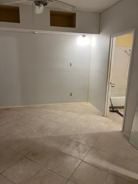 10855 Meadowglen Ln Unit 904, Houston, TX 77042 - basement with light tile patterned flooring