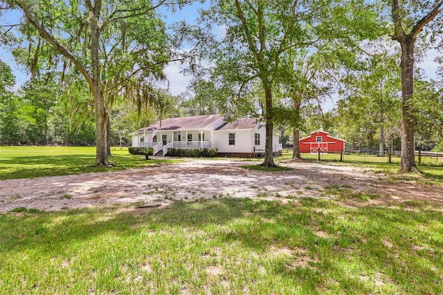 456 Cheatham Rd, Huffman, TX 77336 - back of property with a porch and an outbuilding