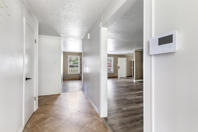 456 Cheatham Rd, Huffman, TX 77336 - hall featuring a textured ceiling