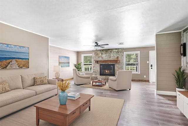456 Cheatham Rd, Huffman, TX 77336 - living area with ceiling fan, a fireplace, wood finished floors, and crown molding