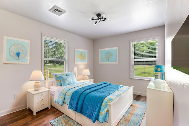 456 Cheatham Rd, Huffman, TX 77336 - bedroom with dark wood-style floors and multiple windows