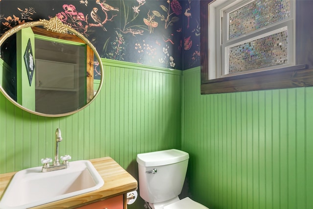 456 Cheatham Rd, Huffman, TX 77336 - half bath with vanity, wainscoting, and wallpapered walls
