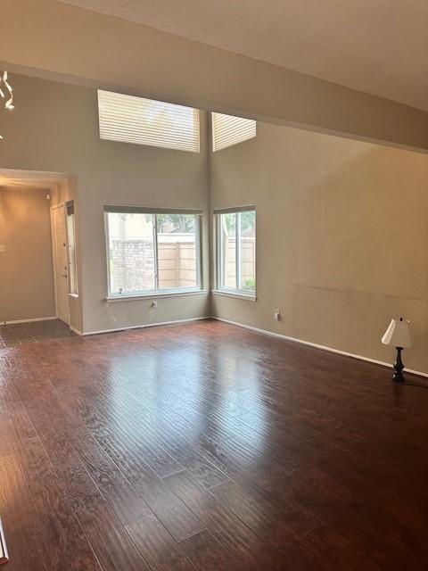 11522 Village Place Dr Unit 81, Houston, TX 77077 - unfurnished room featuring wood finished floors and a towering ceiling