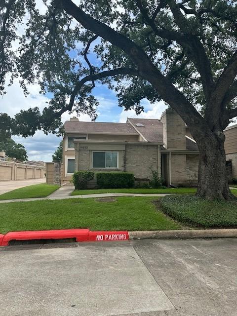 11522 Village Place Dr Unit 81, Houston, TX 77077 - view of front of home featuring a front lawn