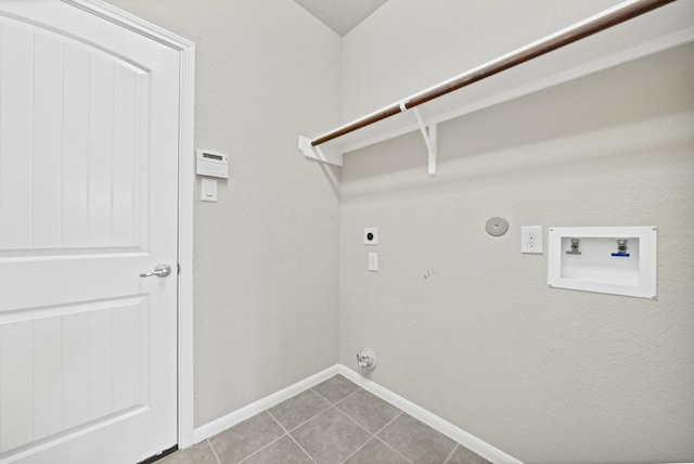 107 Autumn Forest Ln, Conroe, TX 77384 - washroom with gas dryer hookup, electric dryer hookup, light tile patterned floors, and hookup for a washing machine