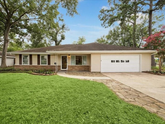9327 Willowview Ln, Houston, TX 77080 - ranch-style house with a garage, driveway, a front lawn, and brick siding