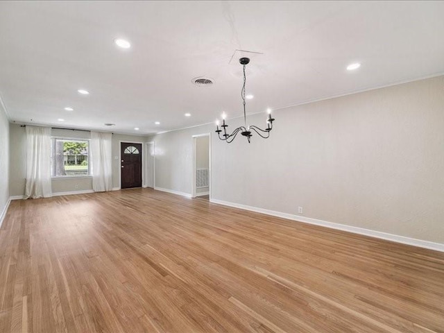 9327 Willowview Ln, Houston, TX 77080 - spare room with a chandelier, recessed lighting, light wood finished floors, and crown molding