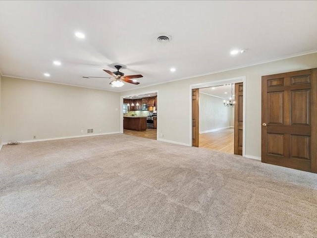 9327 Willowview Ln, Houston, TX 77080 - unfurnished living room with ornamental molding, light colored carpet, recessed lighting, a chandelier, and a ceiling fan