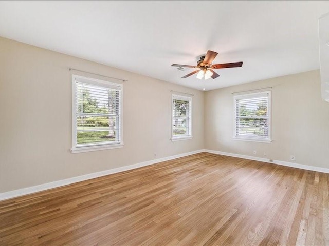 9327 Willowview Ln, Houston, TX 77080 - unfurnished room with healthy amount of natural light, light wood-type flooring, and ceiling fan