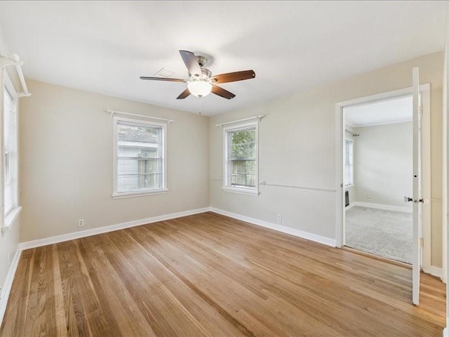 9327 Willowview Ln, Houston, TX 77080 - spare room featuring a ceiling fan and light wood-style floors