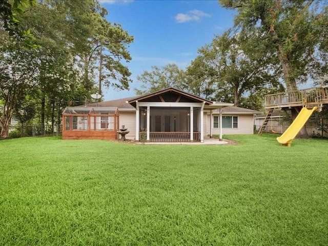 9327 Willowview Ln, Houston, TX 77080 - back of property featuring a sunroom and a playground