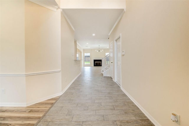 4202 Maurice Way, Stafford, TX 77477 - corridor with crown molding, light wood-style flooring, and recessed lighting