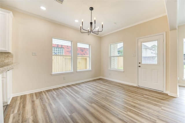 4202 Maurice Way, Stafford, TX 77477 - unfurnished dining area featuring a chandelier, light wood-style flooring, ornamental molding, and recessed lighting