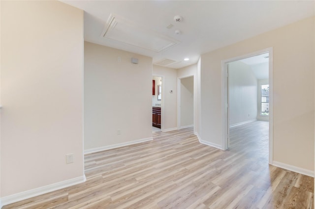 4202 Maurice Way, Stafford, TX 77477 - unfurnished room with attic access, light wood-style floors, and a smoke detector
