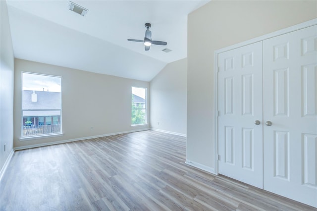 4202 Maurice Way, Stafford, TX 77477 - unfurnished bedroom with light wood-style flooring, a closet, vaulted ceiling, and ceiling fan