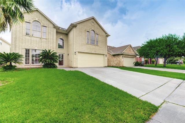 4202 Maurice Way, Stafford, TX 77477 - view of front of house featuring an attached garage, driveway, and brick siding