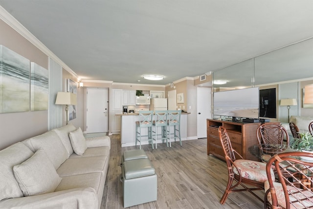 5220 Seawall Blvd Unit 1133C, Galveston, TX 77551 - living area featuring ornamental molding and light wood-style flooring