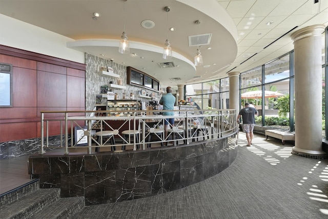 5220 Seawall Blvd Unit 1133C, Galveston, TX 77551 - reception featuring ornate columns, floor to ceiling windows, and recessed lighting