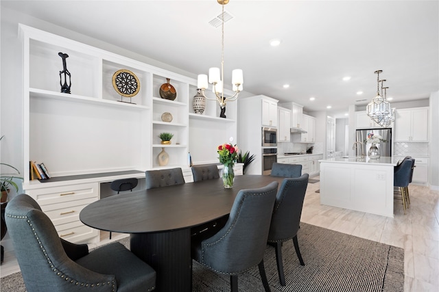 4710 Pecos Ridge Ln, Sugar Land, TX 77479 - dining room featuring a chandelier and recessed lighting