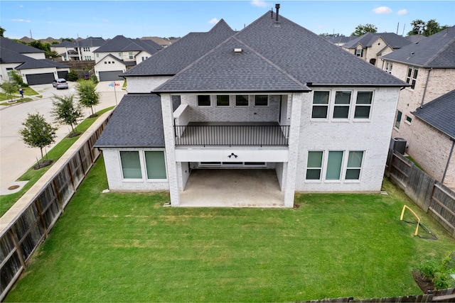 4710 Pecos Ridge Ln, Sugar Land, TX 77479 - back of house with a shingled roof, a patio, a residential view, and a fenced backyard