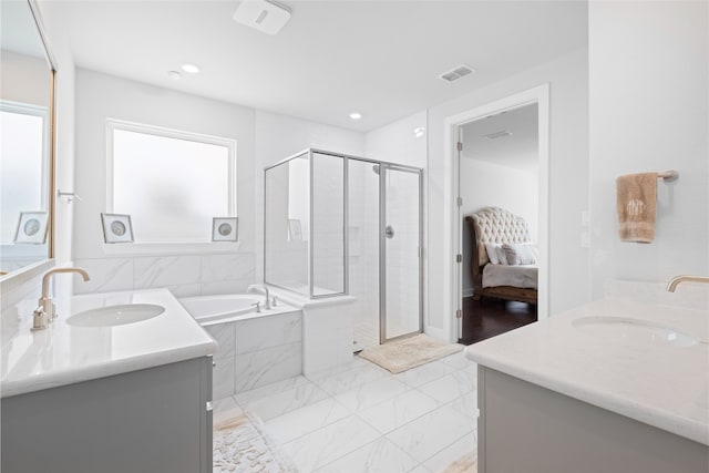 4710 Pecos Ridge Ln, Sugar Land, TX 77479 - bathroom featuring two vanities, a garden tub, a stall shower, marble look tile flooring, and recessed lighting