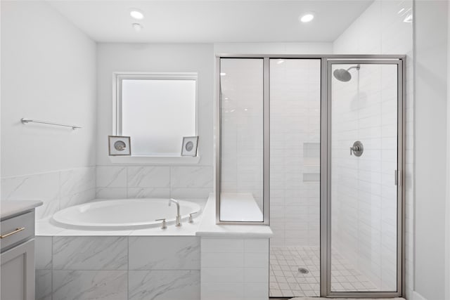 4710 Pecos Ridge Ln, Sugar Land, TX 77479 - full bathroom featuring a garden tub, a shower stall, vanity, and recessed lighting