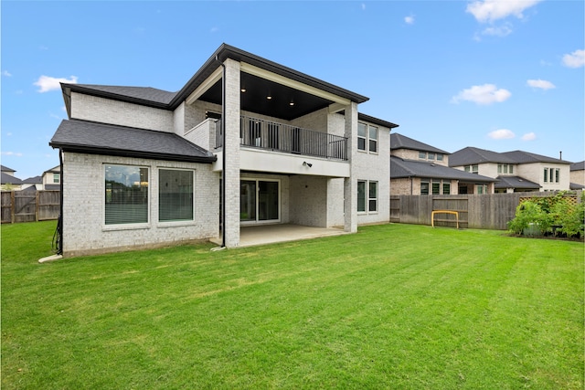 4710 Pecos Ridge Ln, Sugar Land, TX 77479 - rear view of house featuring a balcony, a fenced backyard, a patio area, and brick siding