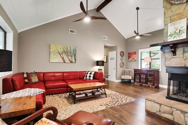 221 Kings Way, Coldspring, TX 77331 - living room with ceiling fan, a stone fireplace, wood finished floors, high vaulted ceiling, and beam ceiling
