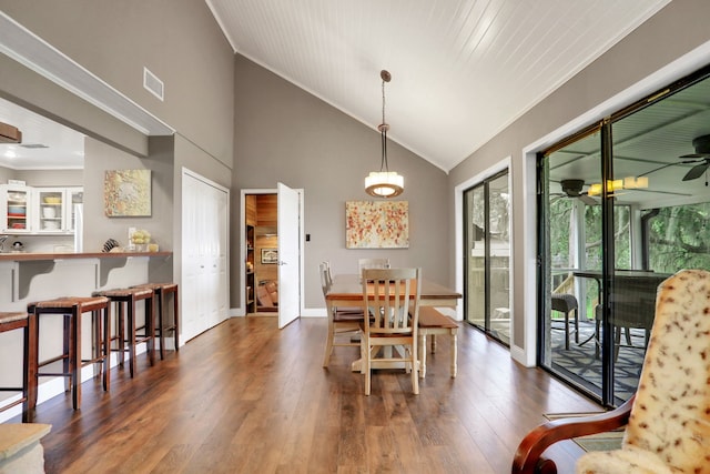 221 Kings Way, Coldspring, TX 77331 - dining space with crown molding, ceiling fan, wood finished floors, and high vaulted ceiling