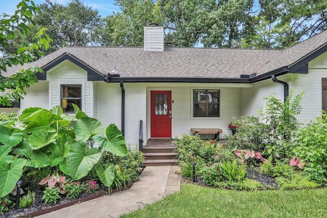 221 Kings Way, Coldspring, TX 77331 - single story home with a chimney, roof with shingles, and brick siding
