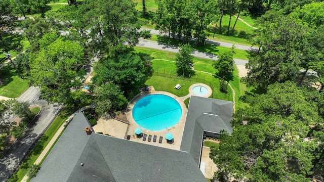 221 Kings Way, Coldspring, TX 77331 - aerial view of a pool area and a tree filled landscape