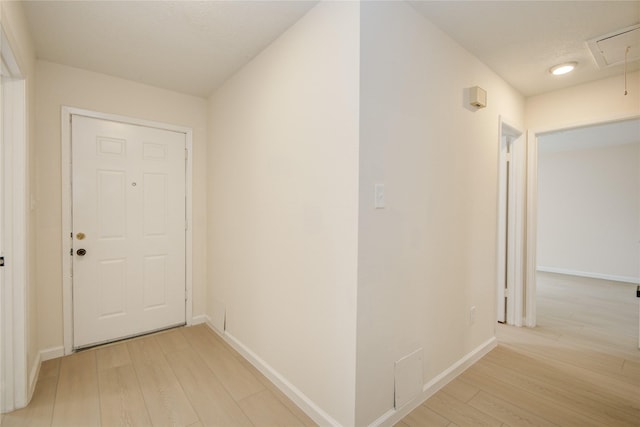 12803 High Star Dr, Houston, TX 77072 - hallway with light wood finished floors and attic access
