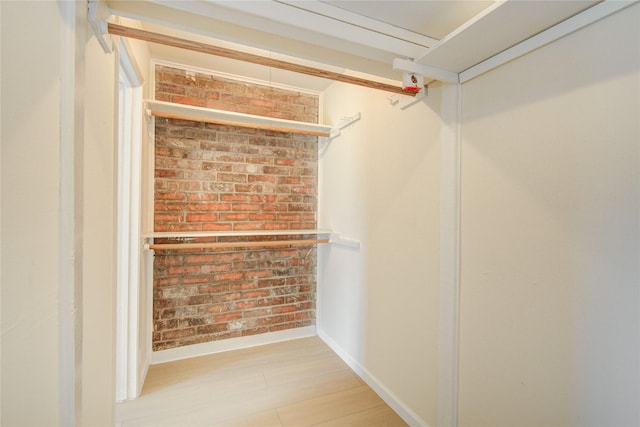 12803 High Star Dr, Houston, TX 77072 - walk in closet with wood finished floors